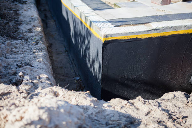 Professional Basement Waterproofing technician working in Duncan Falls, OH